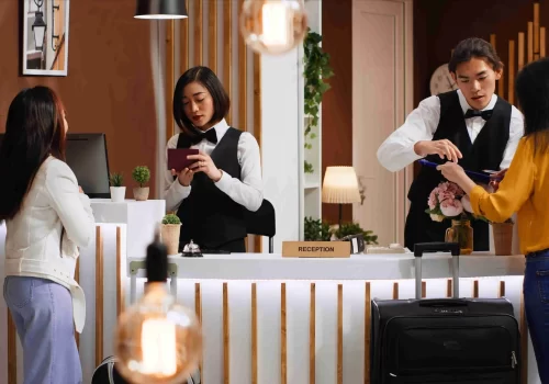tourists-going-through-check-process-hotel-reception-desk_11zon